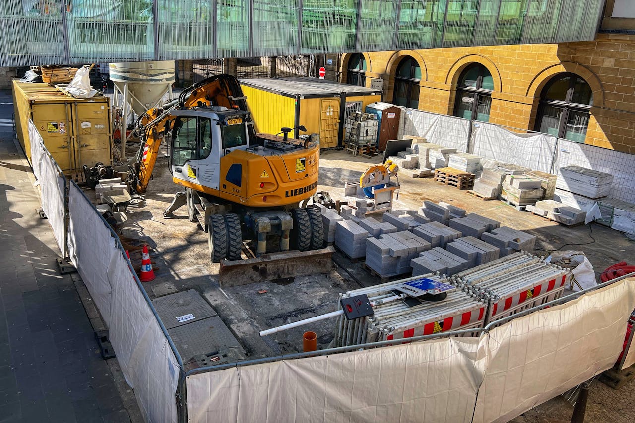 The Art of Drawing Readers In: Your attractive post title goes here A construction site with machinery and materials in an urban setting during daytime.