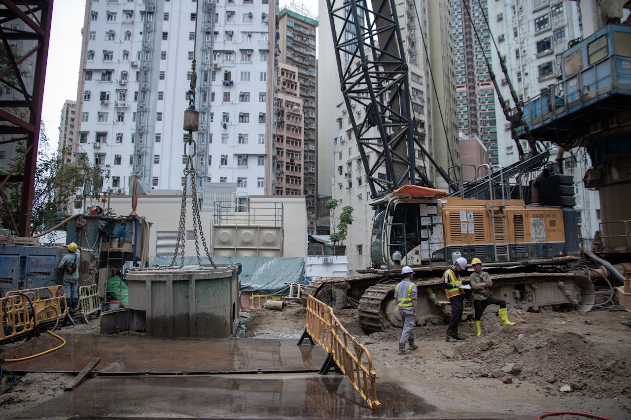 Crafting Captivating Headlines: Your awesome post title goes here City construction site with workers, cranes, and high-rise buildings.